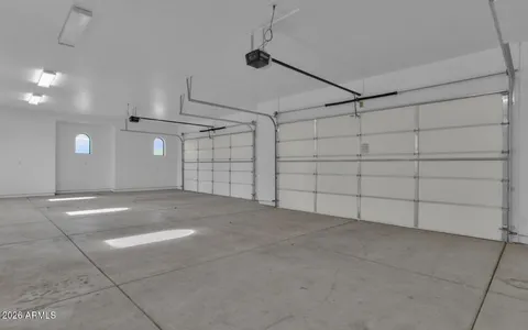 a bathroom with a granite countertop sink vanity and toilet
