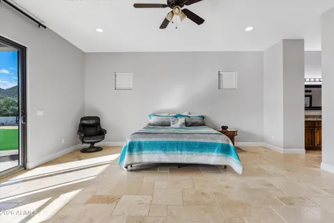 a spacious bathroom with a tub sink and mirror