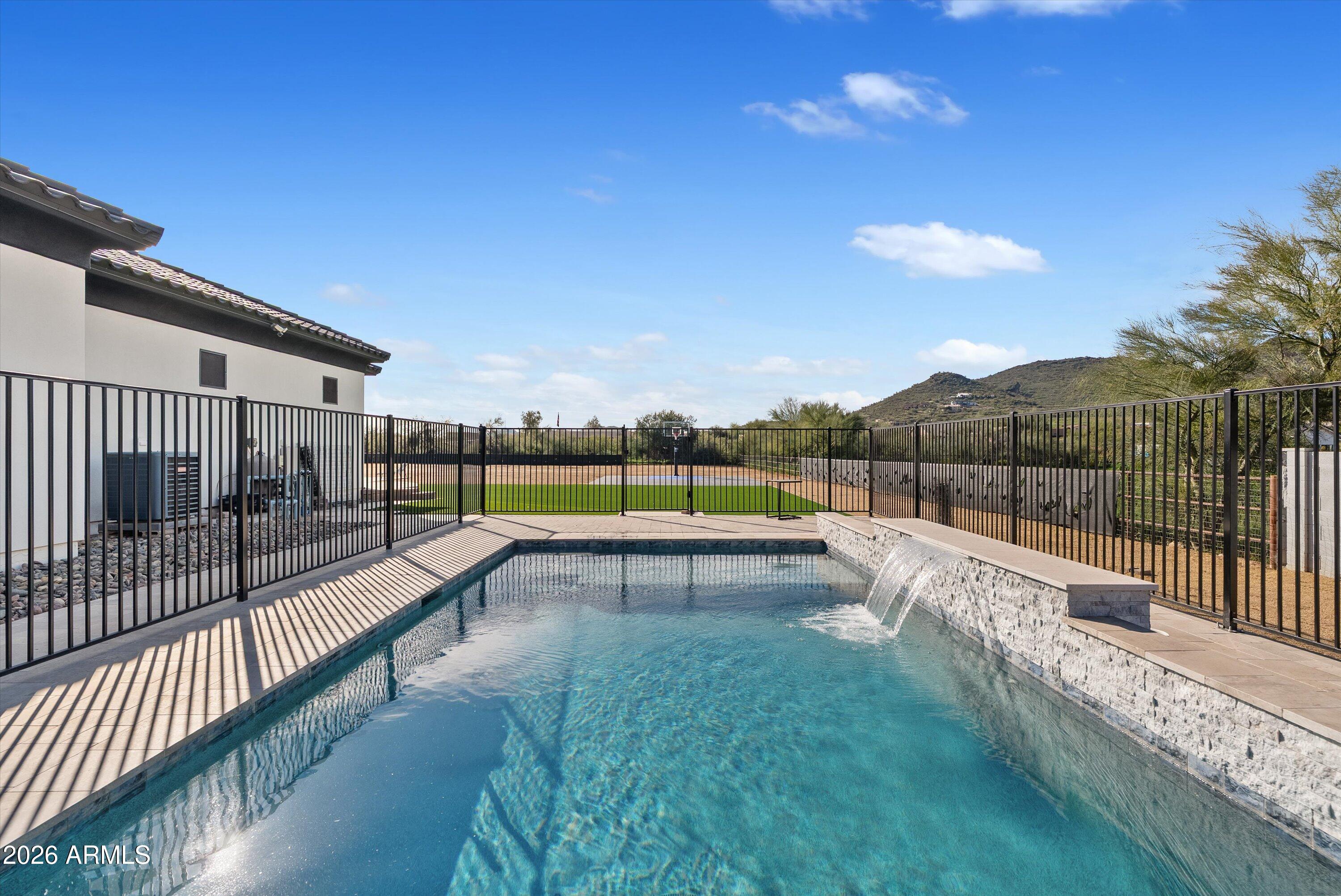 1617 West Maddock Road Phoenix, AZ 85086 - Photo 45 of 50 a view of a swimming pool with a garden