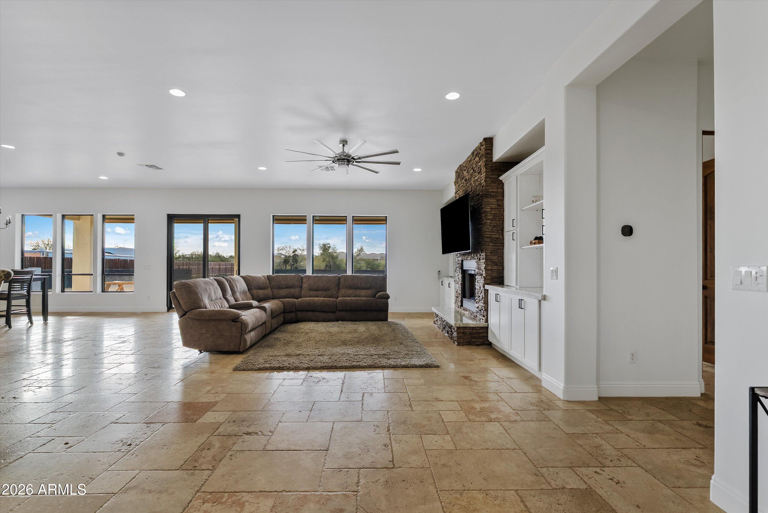 1617 West Maddock Road Phoenix, AZ 85086 - Photo 7 of 50 a living room with furniture and a flat screen tv
