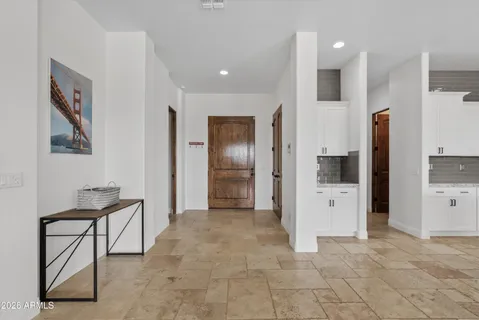 a view of a hallway with chairs