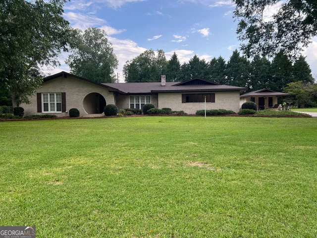 a house view with a garden space