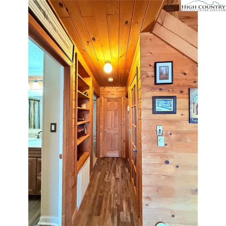 154 Breezy Lane Deep Gap, NC 28618 - Photo 12 of 46 a view of a hallway with wooden floor and entryway