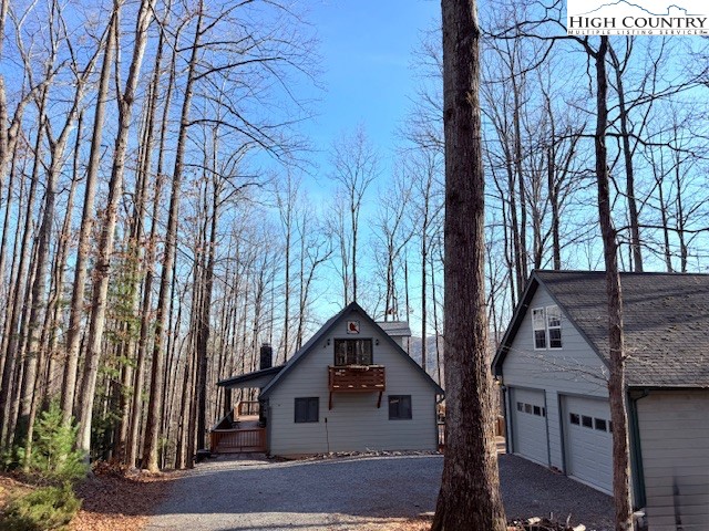 154 Breezy Lane Deep Gap, NC 28618 - Photo 21 of 46 front view of a house with a trees