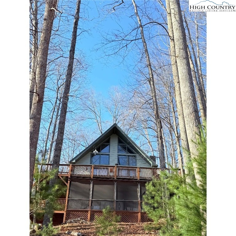 154 Breezy Lane Deep Gap, NC 28618 - Photo 41 of 46 a view of a house with a small yard