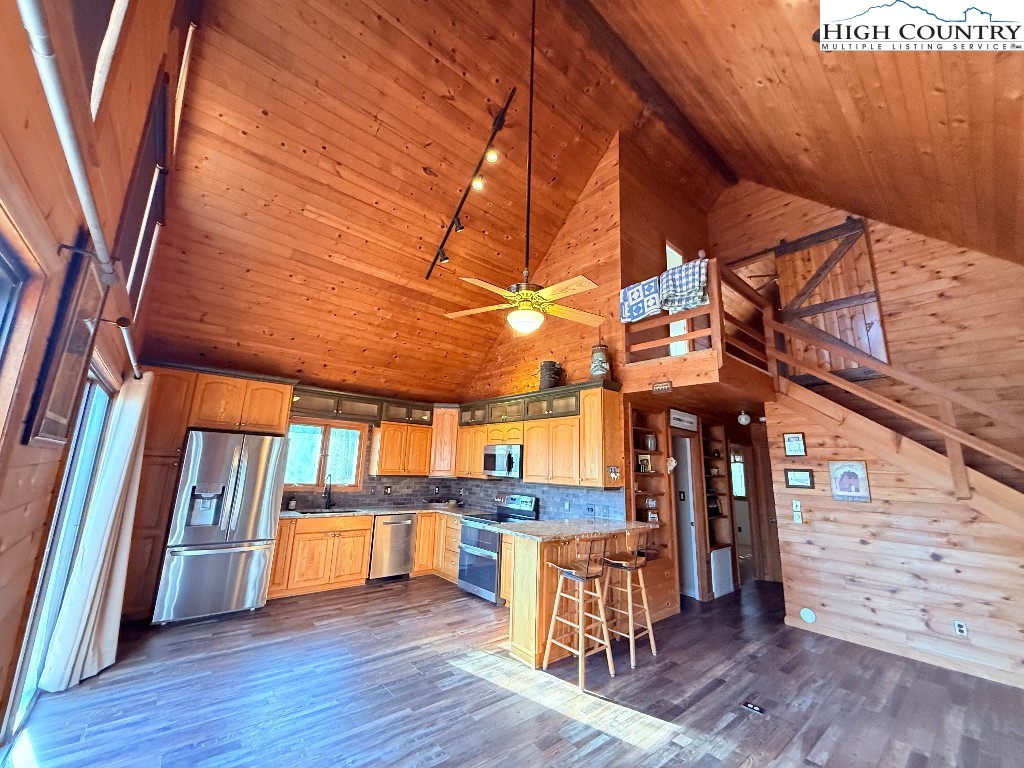 154 Breezy Lane Deep Gap, NC 28618 - Photo 6 of 46 a view of a room with wooden floor and furniture