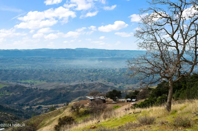 a view of a city with mountains in the background