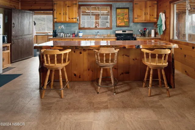 a view of a livingroom with furniture and a flat screen tv