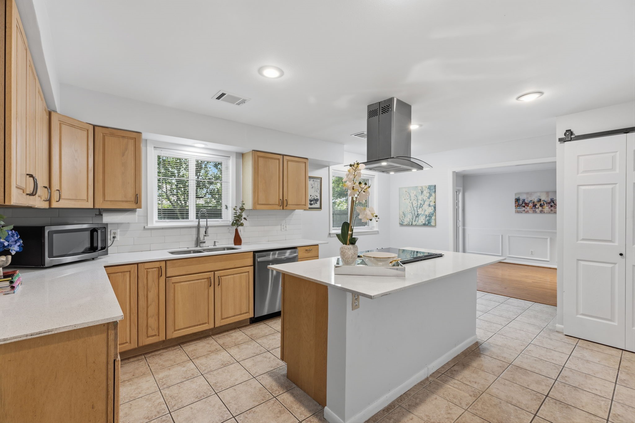 5410 Indigo Street Houston, TX 77096 - Photo 13 of 30 Opposite view of the kitchen with sleek countertops, a Chef's Island and tons of cabinets open to breakfast and dining areas.