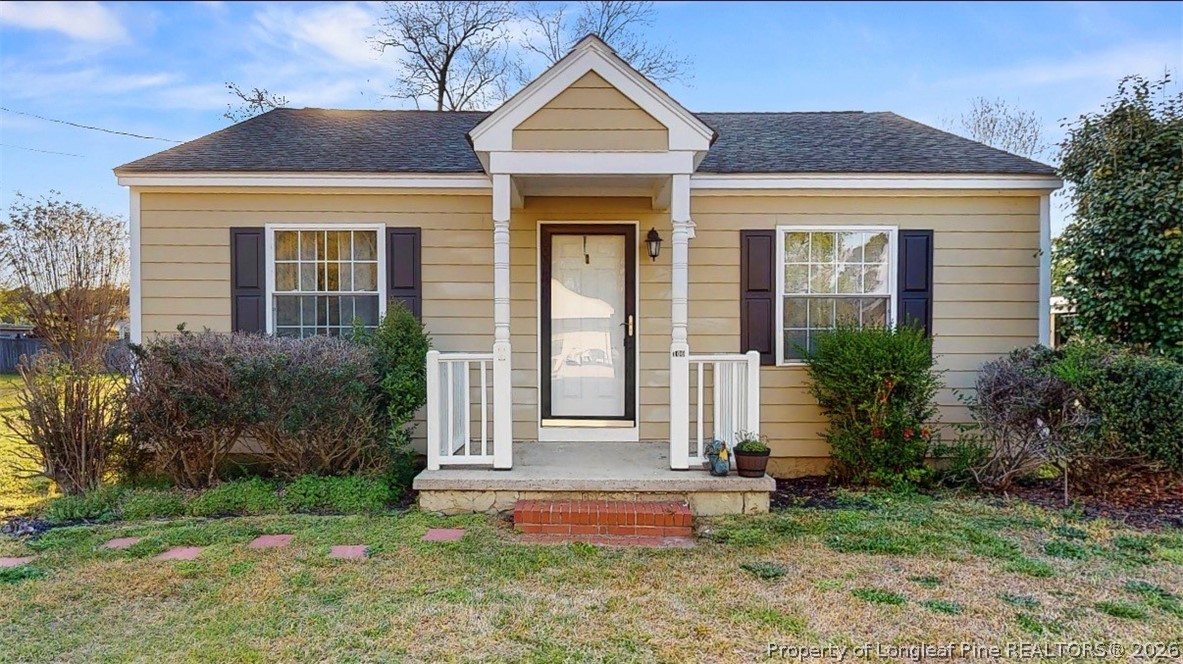 106 County Avenue Dunn, NC 28334 - Photo 1 of 24 a front view of a house with a yard