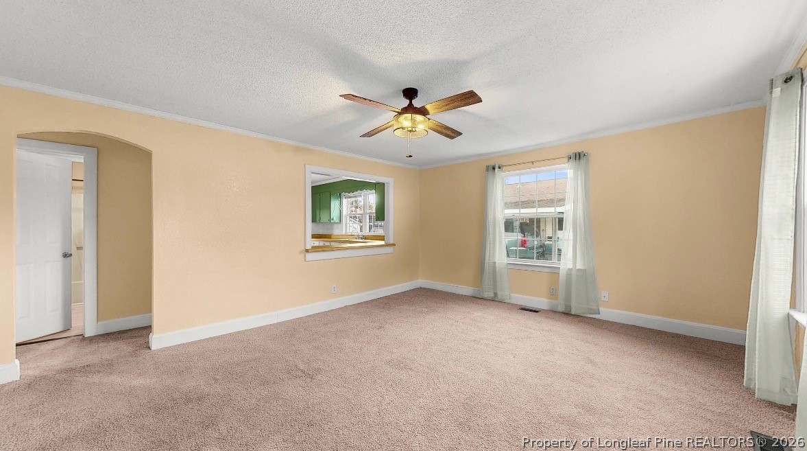 106 County Avenue Dunn, NC 28334 - Photo 11 of 24 an empty room with windows and fan