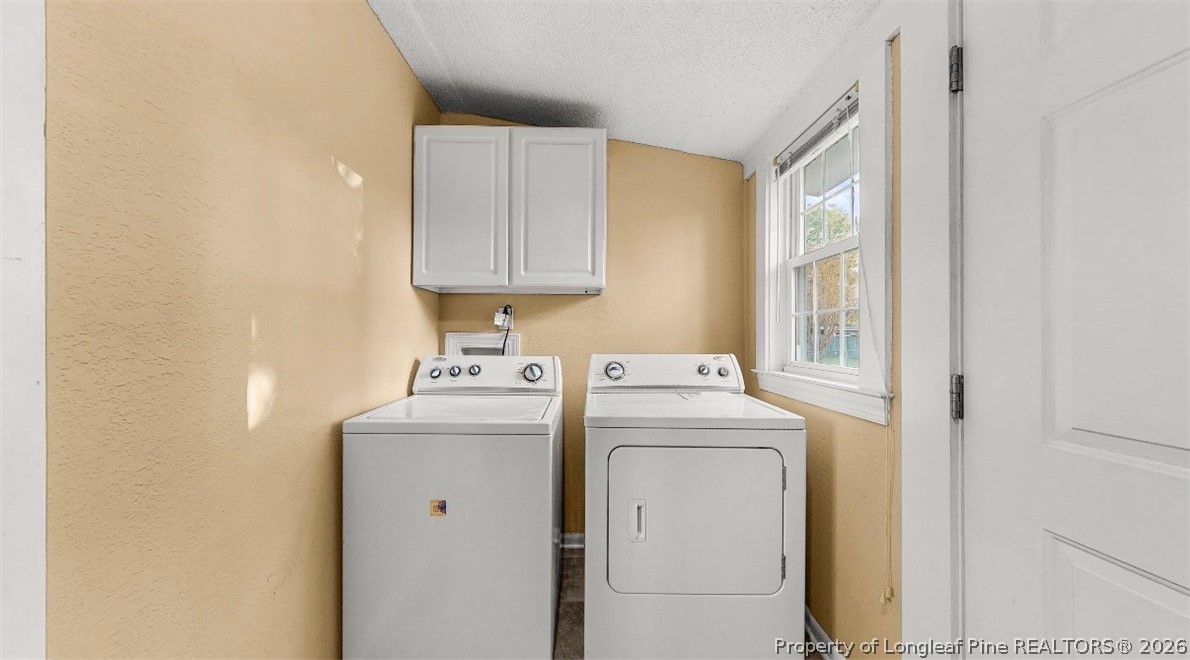 106 County Avenue Dunn, NC 28334 - Photo 15 of 24 a utility room with dryer and washer
