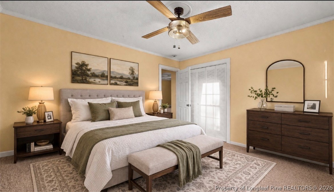 106 County Avenue Dunn, NC 28334 - Photo 19 of 24 a bedroom with a bed and a table