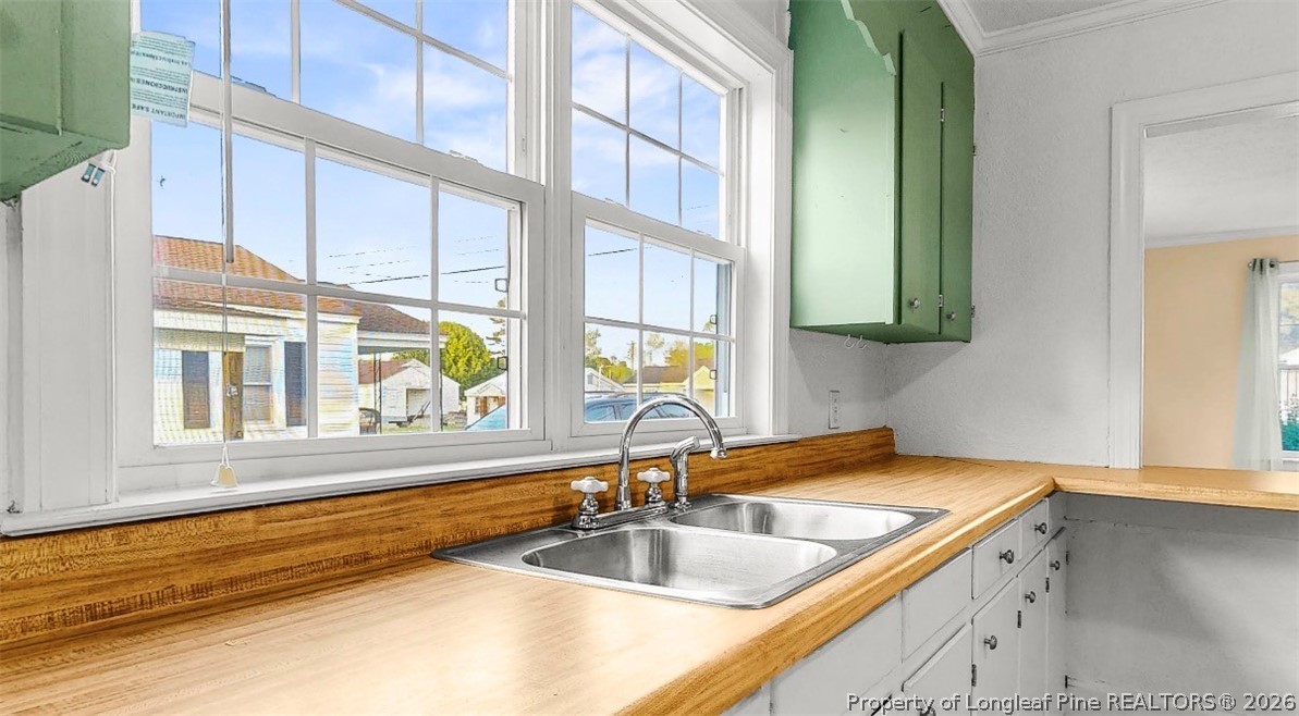 106 County Avenue Dunn, NC 28334 - Photo 7 of 24 a kitchen with a sink and a window