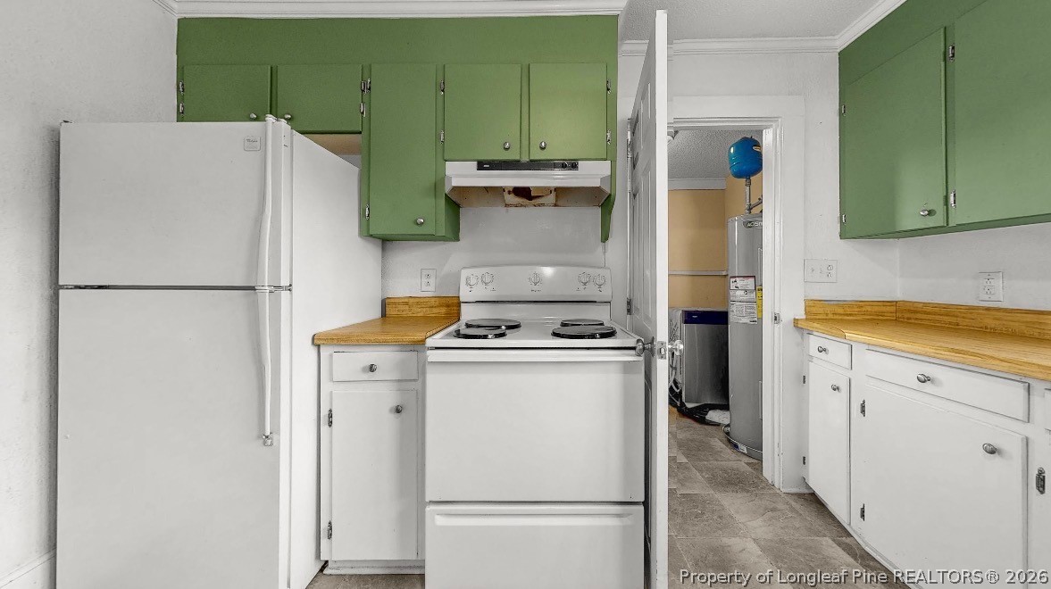 106 County Avenue Dunn, NC 28334 - Photo 8 of 24 a white refrigerator freezer and a stove sitting inside of a kitchen