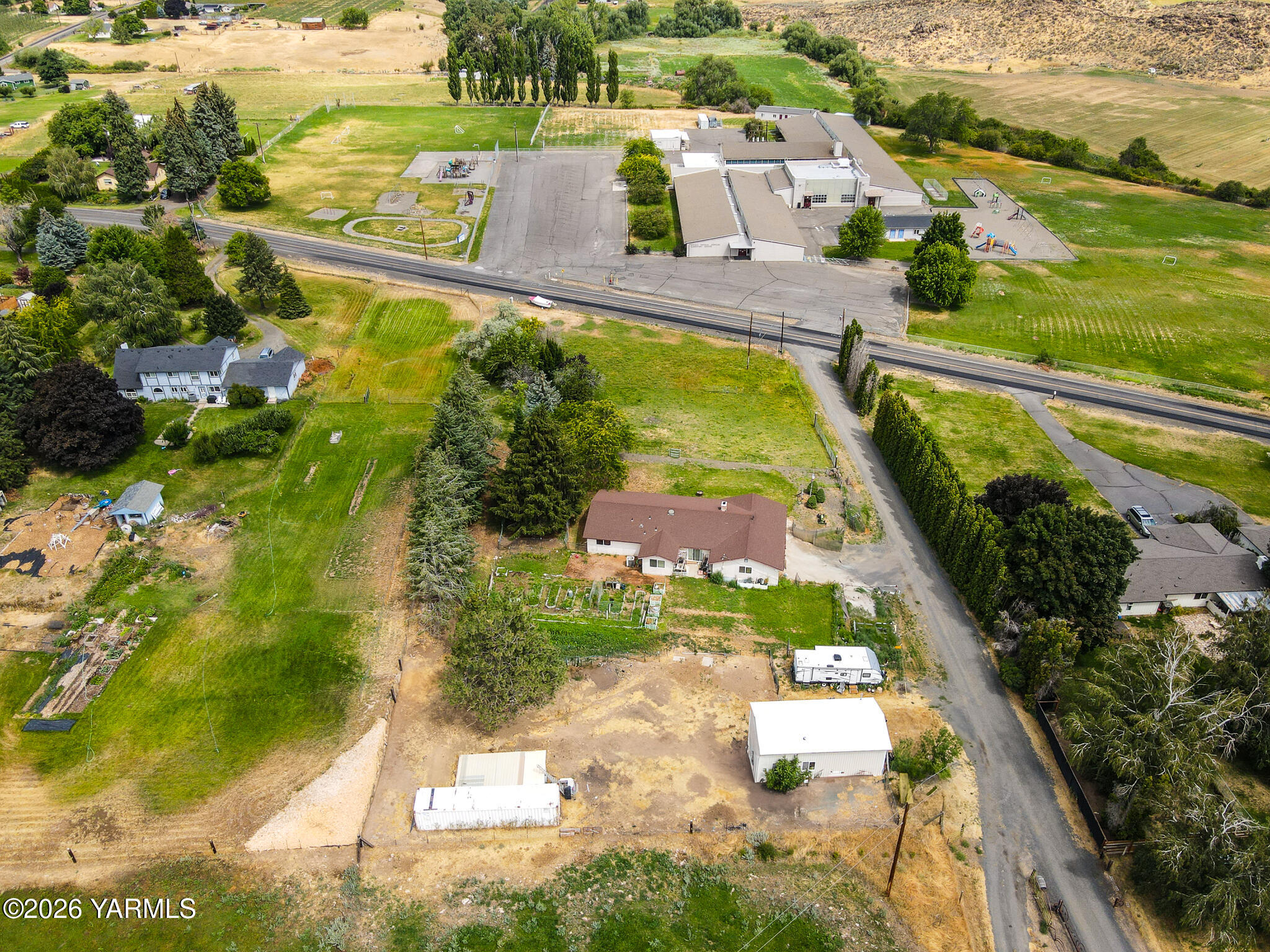1130 Thompson Road Cowiche, WA 98923 - Photo 24 of 25 a view of a swimming pool with a yard