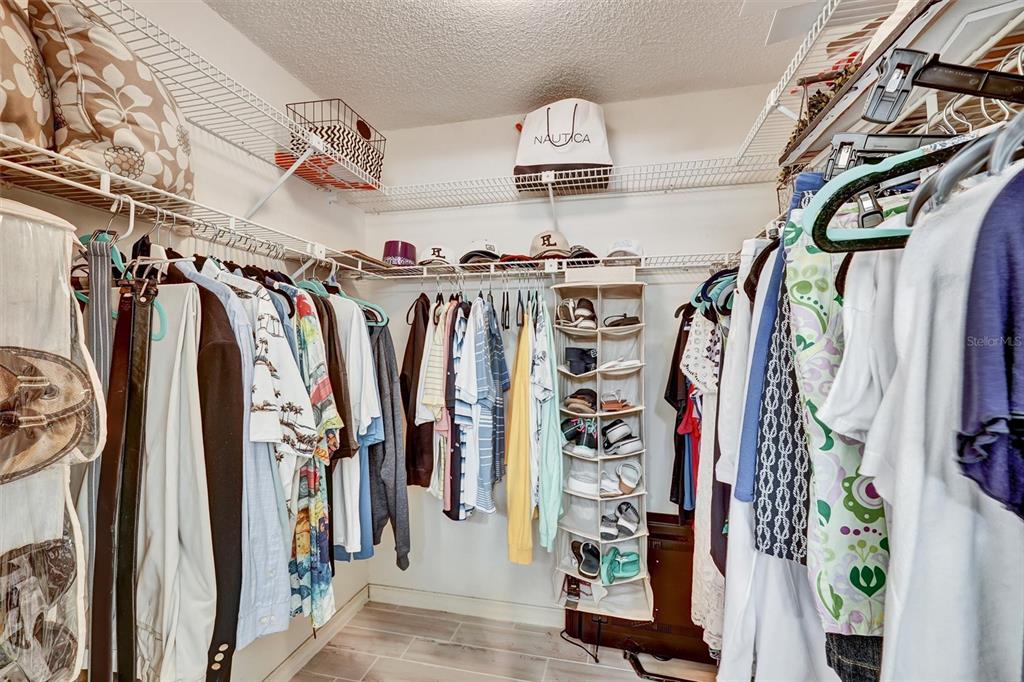 6221 Timberlake Drive, Unit C10 Sarasota, FL 34243 - Photo 19 of 27 a view of walk in closet with clothes