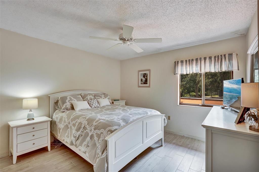 6221 Timberlake Drive, Unit C10 Sarasota, FL 34243 - Photo 20 of 27 a bedroom with a bed and a window