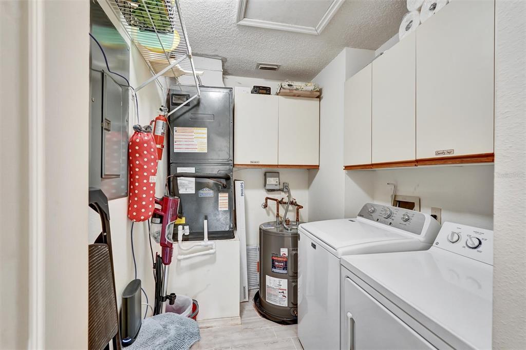 6221 Timberlake Drive, Unit C10 Sarasota, FL 34243 - Photo 24 of 27 a utility room with dryer and washer