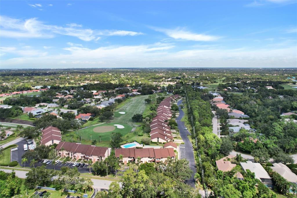 6221 Timberlake Drive, Unit C10 Sarasota, FL 34243 - Photo 26 of 27 an aerial view of city and lake