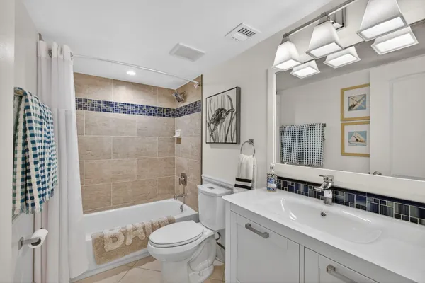 an aerial view of a residential houses with outdoor space