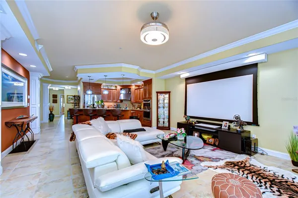 a living room with furniture a rug and a large window