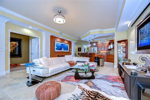 a living room with furniture a rug and a large window