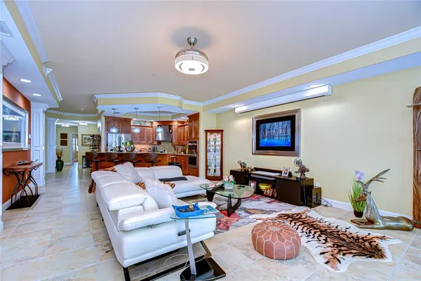 a living room with fireplace furniture and a flat screen tv