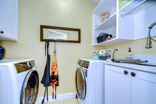 a view of a swimming pool with a patio