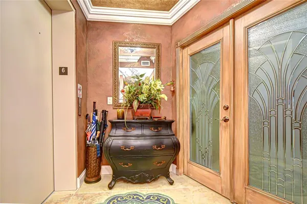 a room with furniture and a potted plant