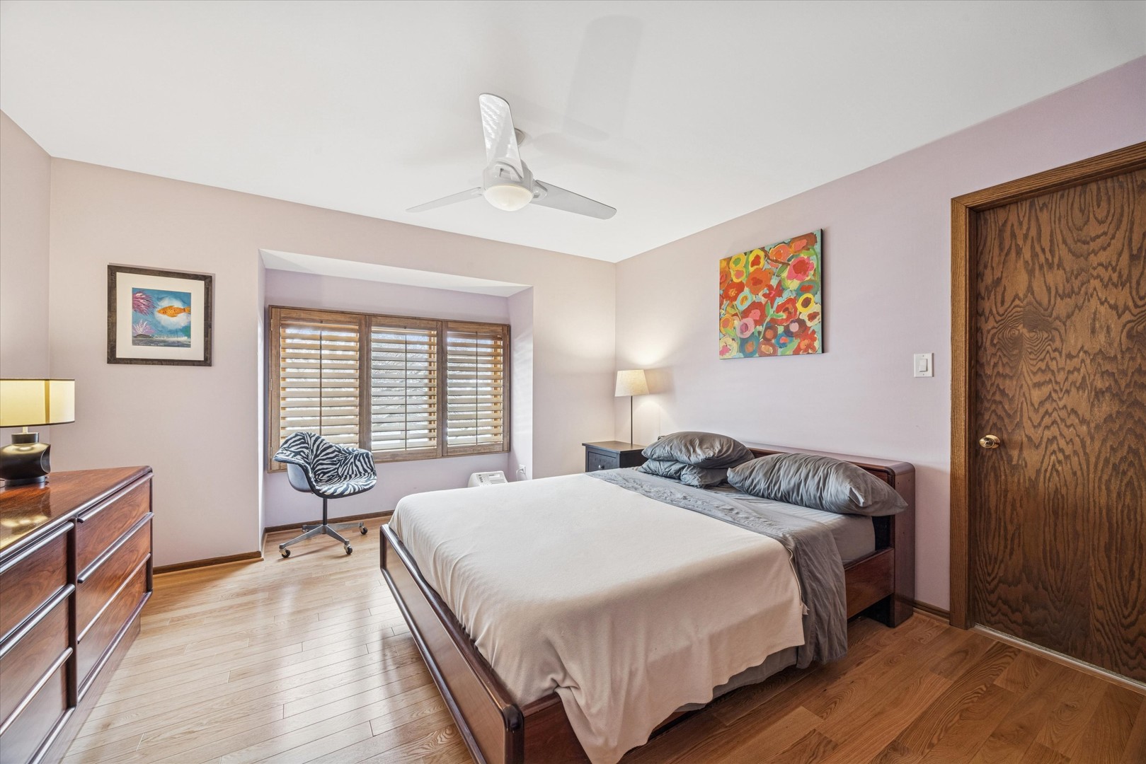 7612 Ridgewood Lane Burr Ridge, IL 60527 - Photo 13 of 36 a bedroom with a bed and wooden floor