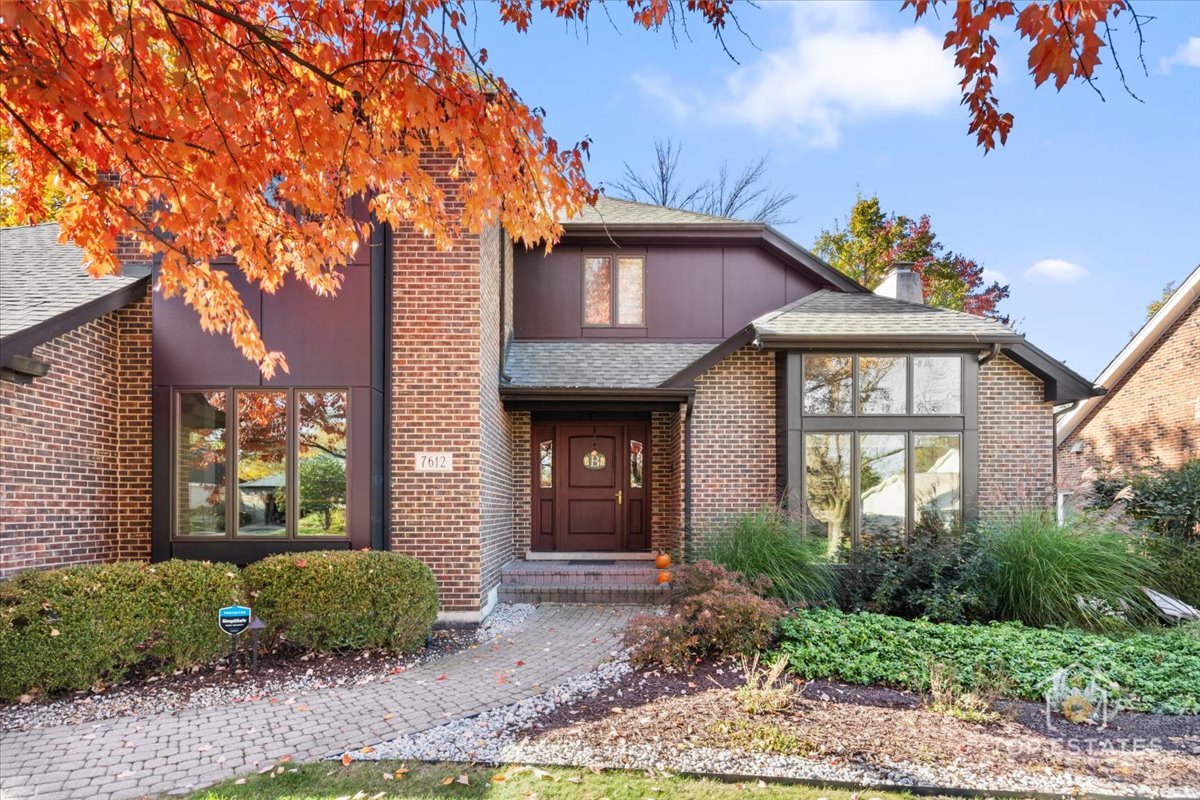 7612 Ridgewood Lane Burr Ridge, IL 60527 - Photo 23 of 36 a front view of a house with garden