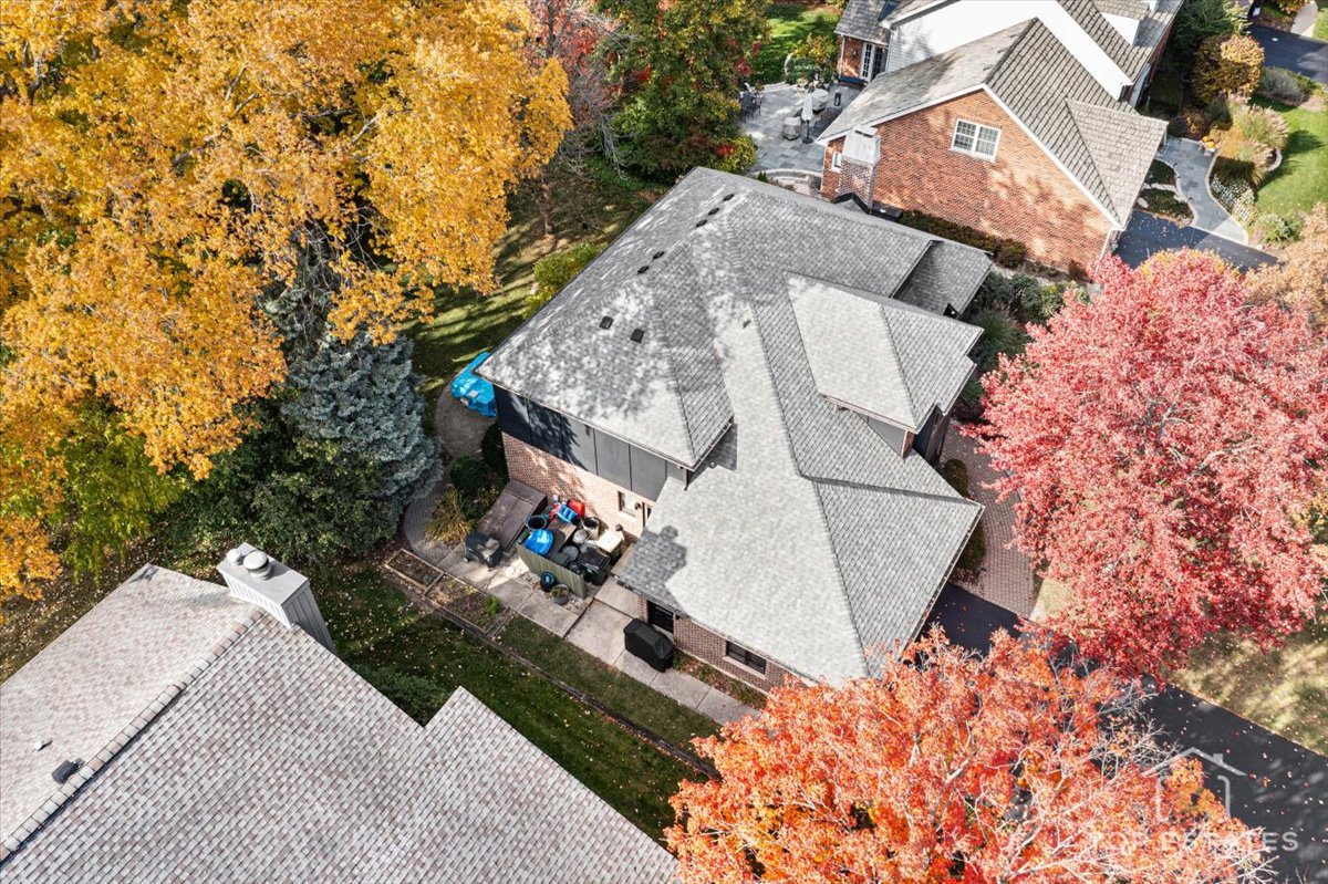 7612 Ridgewood Lane Burr Ridge, IL 60527 - Photo 29 of 36 an aerial view of a house with a yard and trees