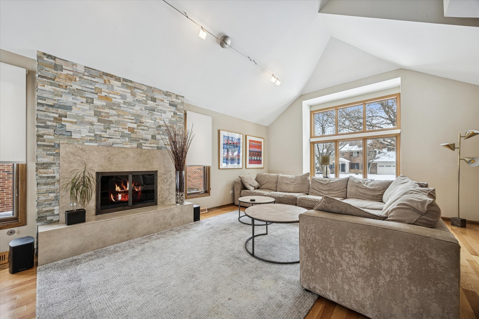 7612 Ridgewood Lane Burr Ridge, IL 60527 - Photo 3 of 36 a living room with furniture and a fireplace