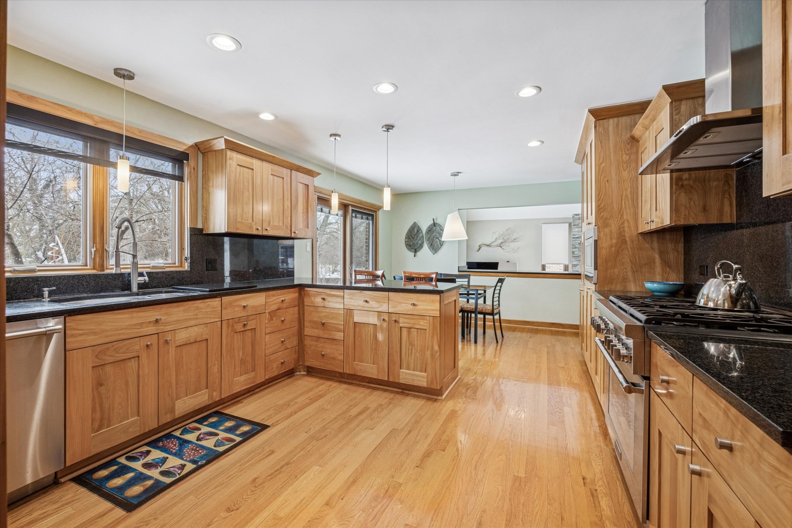 7612 Ridgewood Lane Burr Ridge, IL 60527 - Photo 6 of 36 a kitchen with stainless steel appliances granite countertop a stove a sink and a microwave