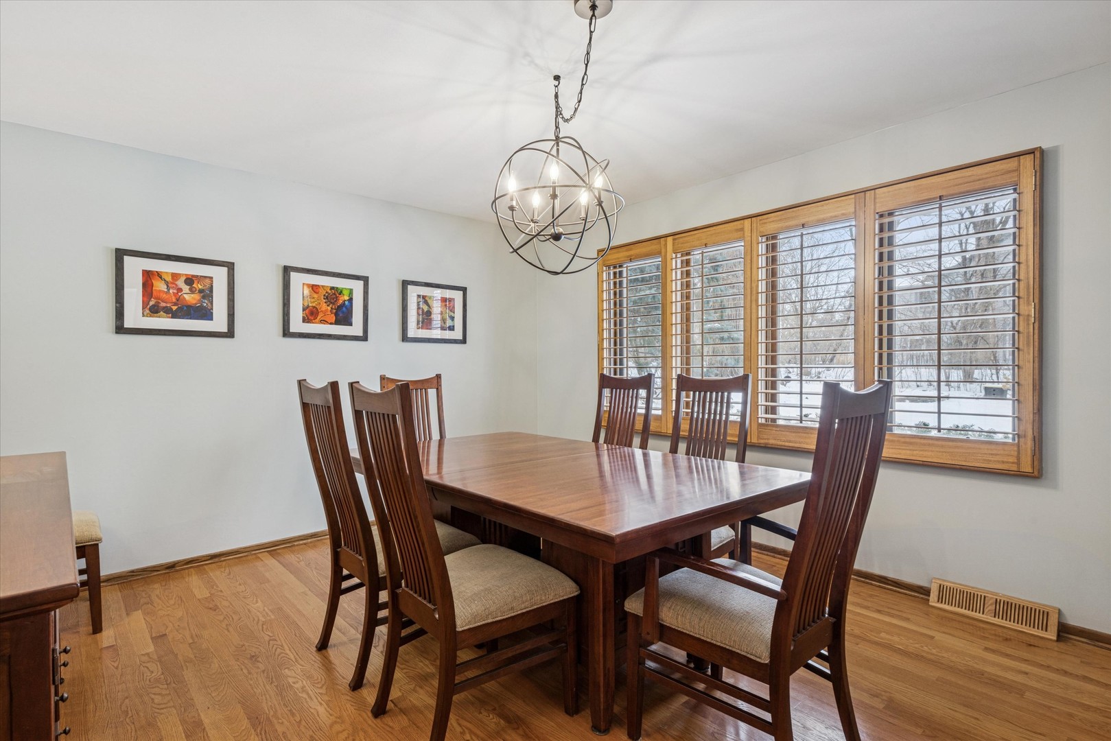 7612 Ridgewood Lane Burr Ridge, IL 60527 - Photo 7 of 36 a view of a dining room with furniture window and wooden floor