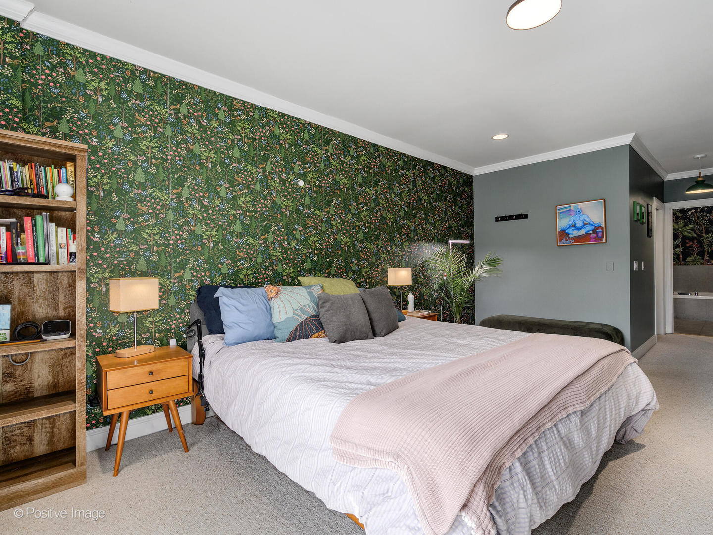 830 West Bradley Place, Unit 3S Chicago, IL 60613 - Photo 15 of 22 a bedroom with a bed and a bookshelf