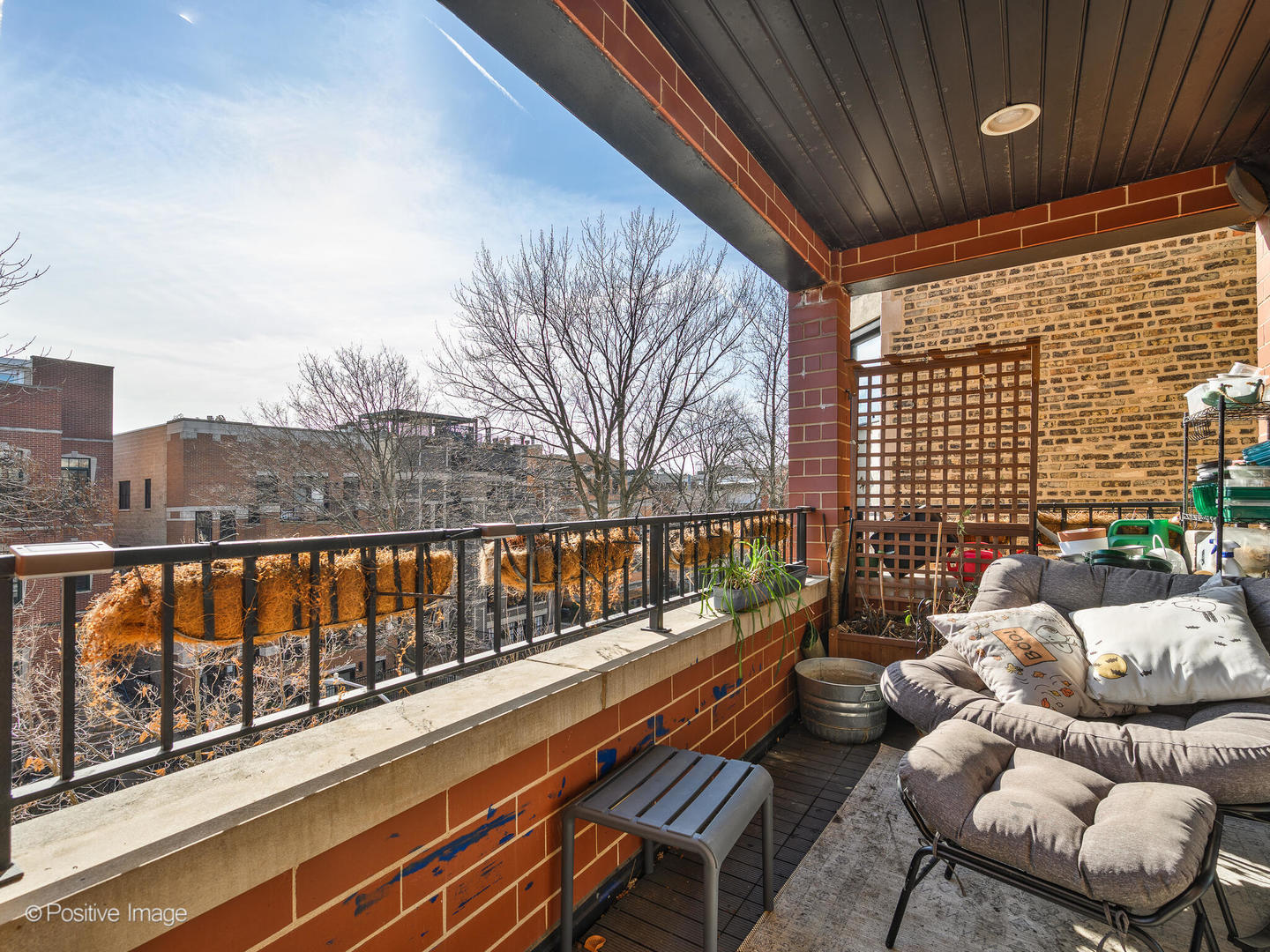 830 West Bradley Place, Unit 3S Chicago, IL 60613 - Photo 7 of 22 a balcony with chairs and wooden floor