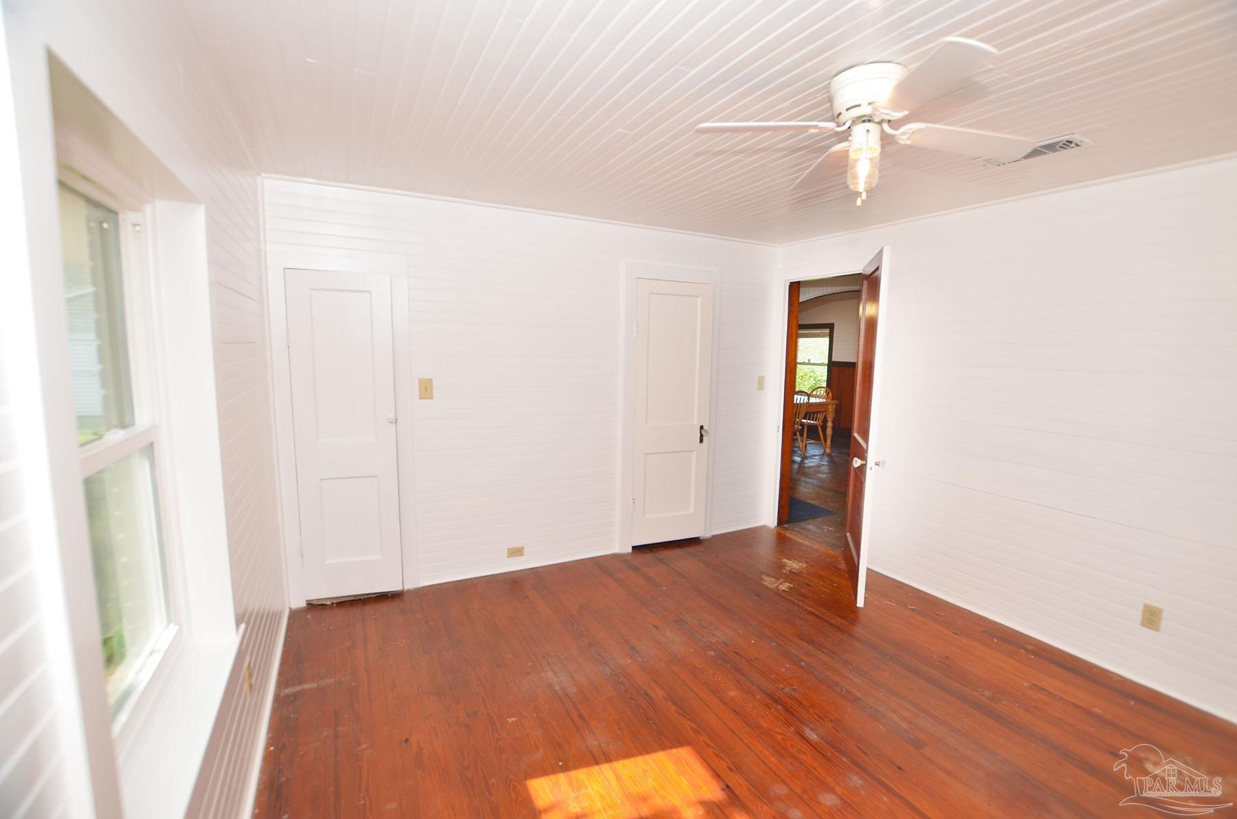6475 Chestnut Road Molino, FL 32577 - Photo 24 of 67 a view of an empty room with wooden floor