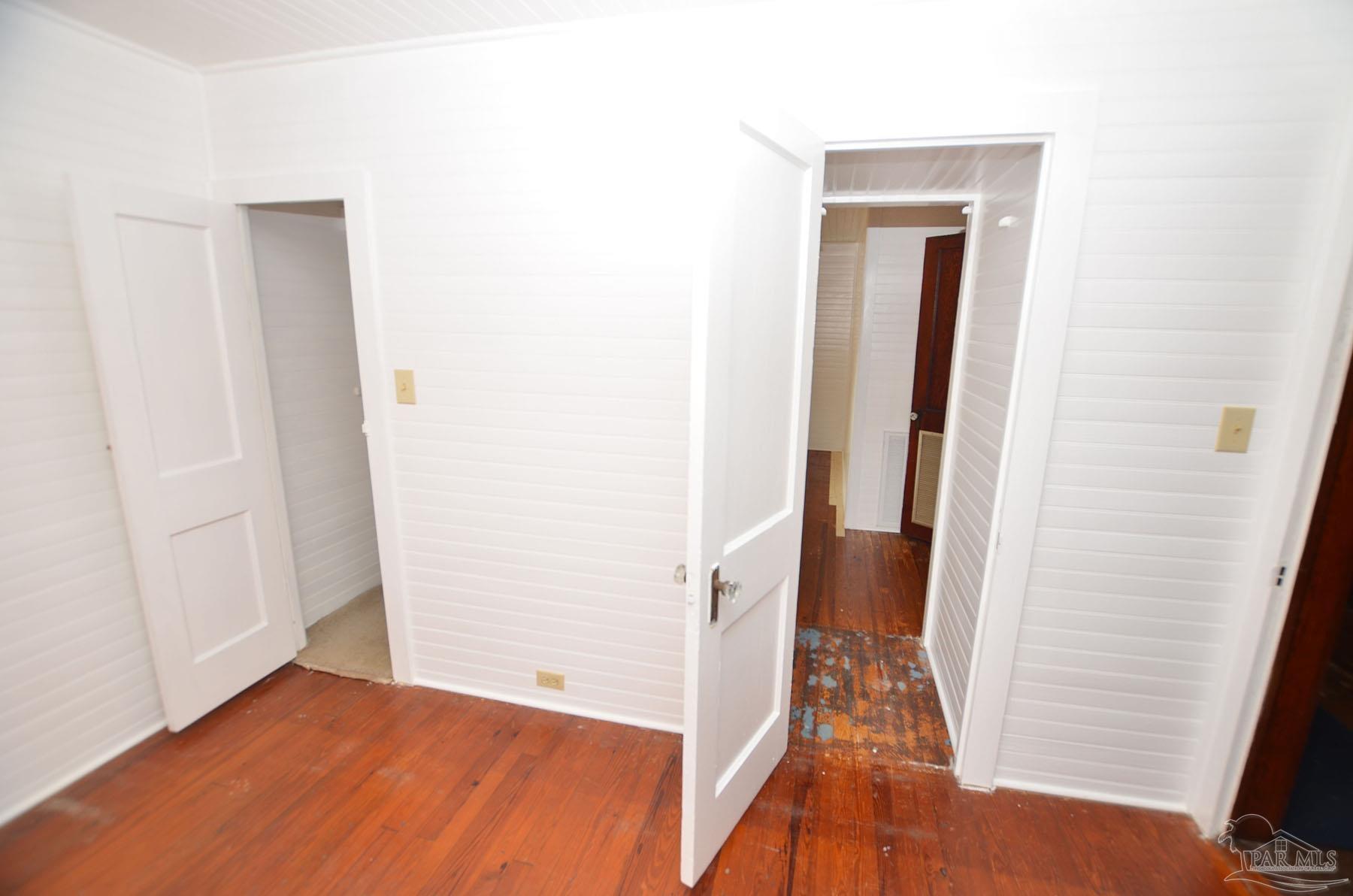 6475 Chestnut Road Molino, FL 32577 - Photo 25 of 67 a view of a hallway with wooden floor and closet
