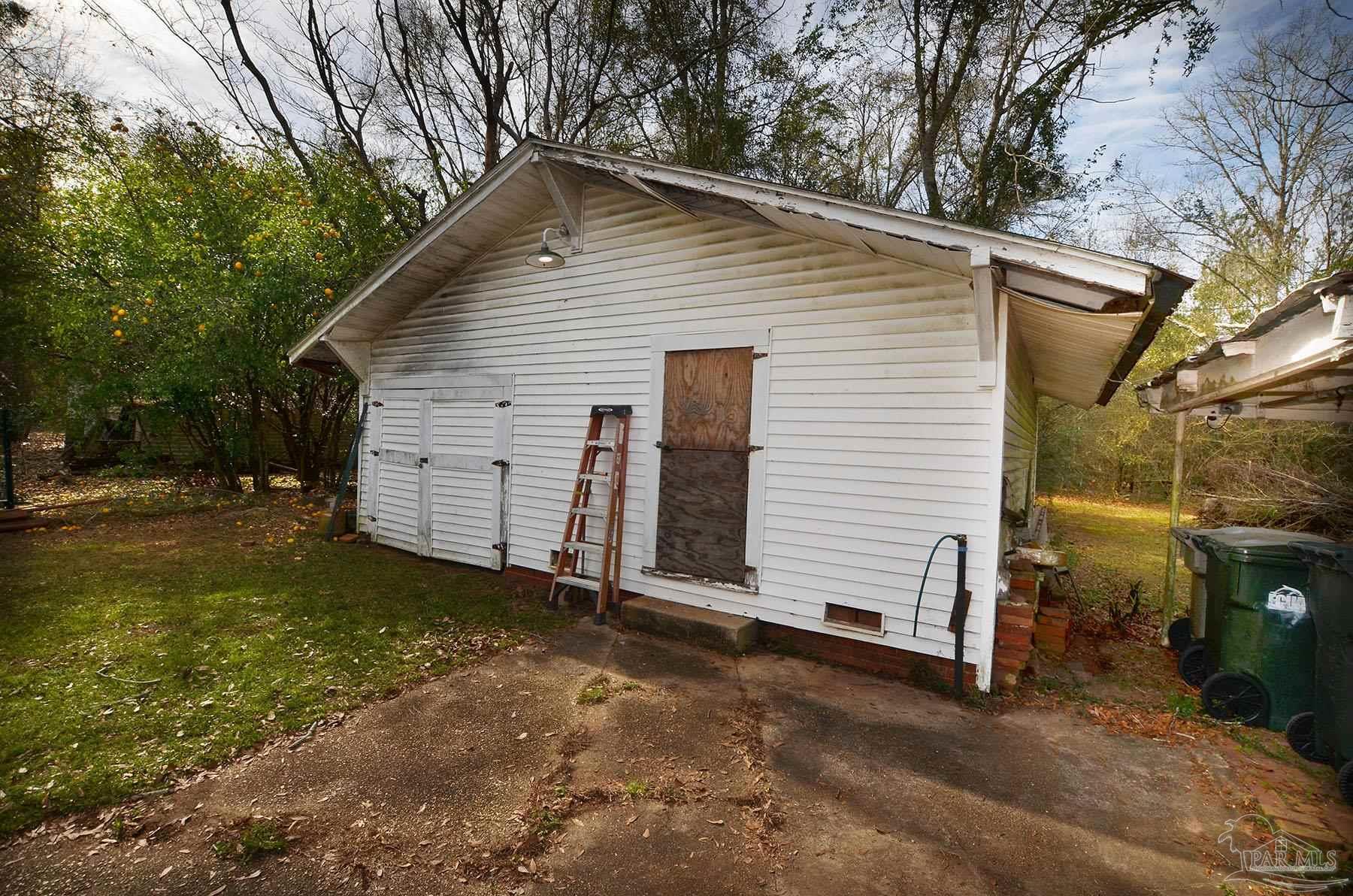 6475 Chestnut Road Molino, FL 32577 - Photo 59 of 67 a view of a house with a yard