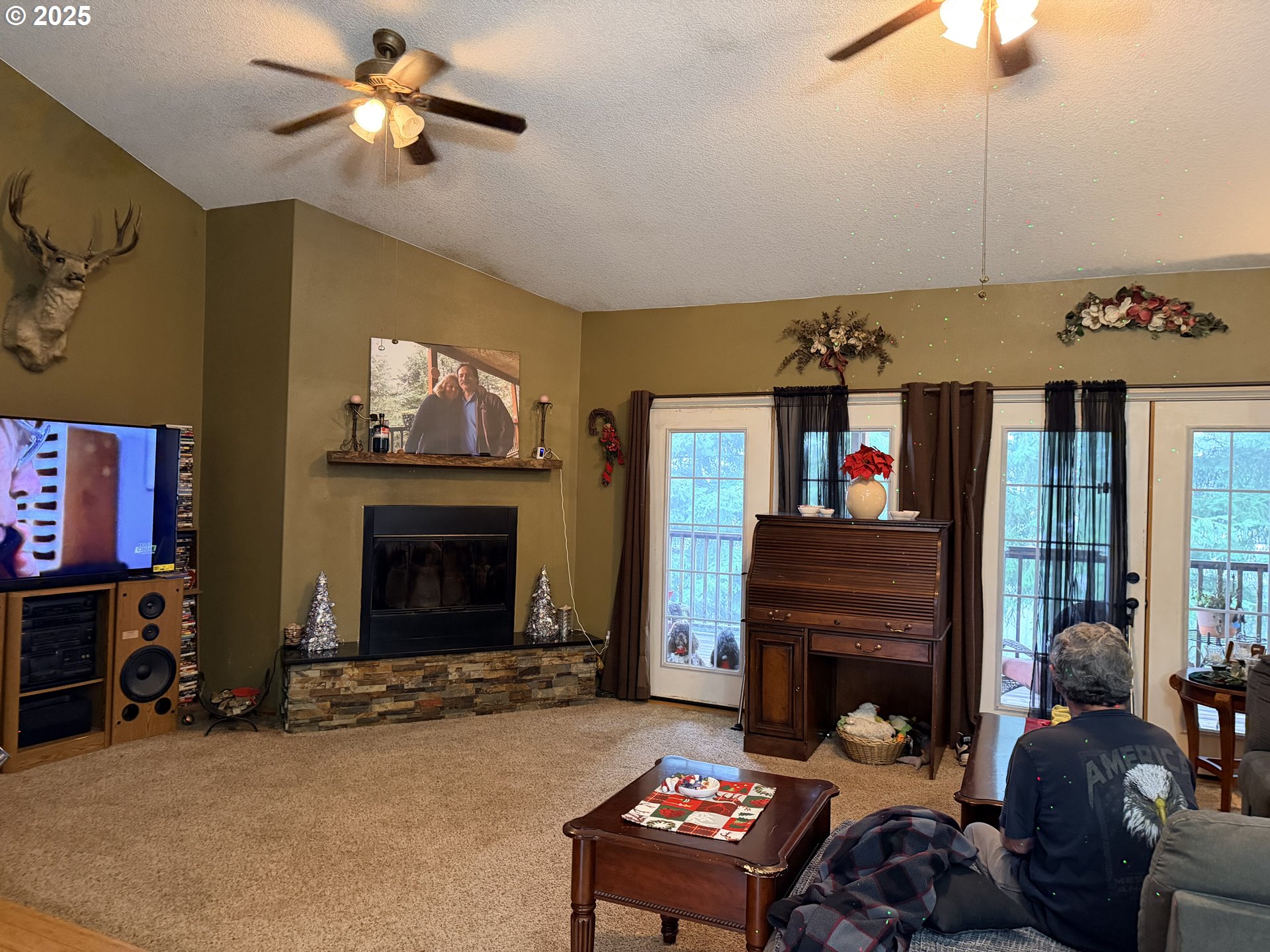 154 Shipview Road Kalama, WA 98625 - Photo 4 of 22 a living room with furniture a fireplace and a chandelier