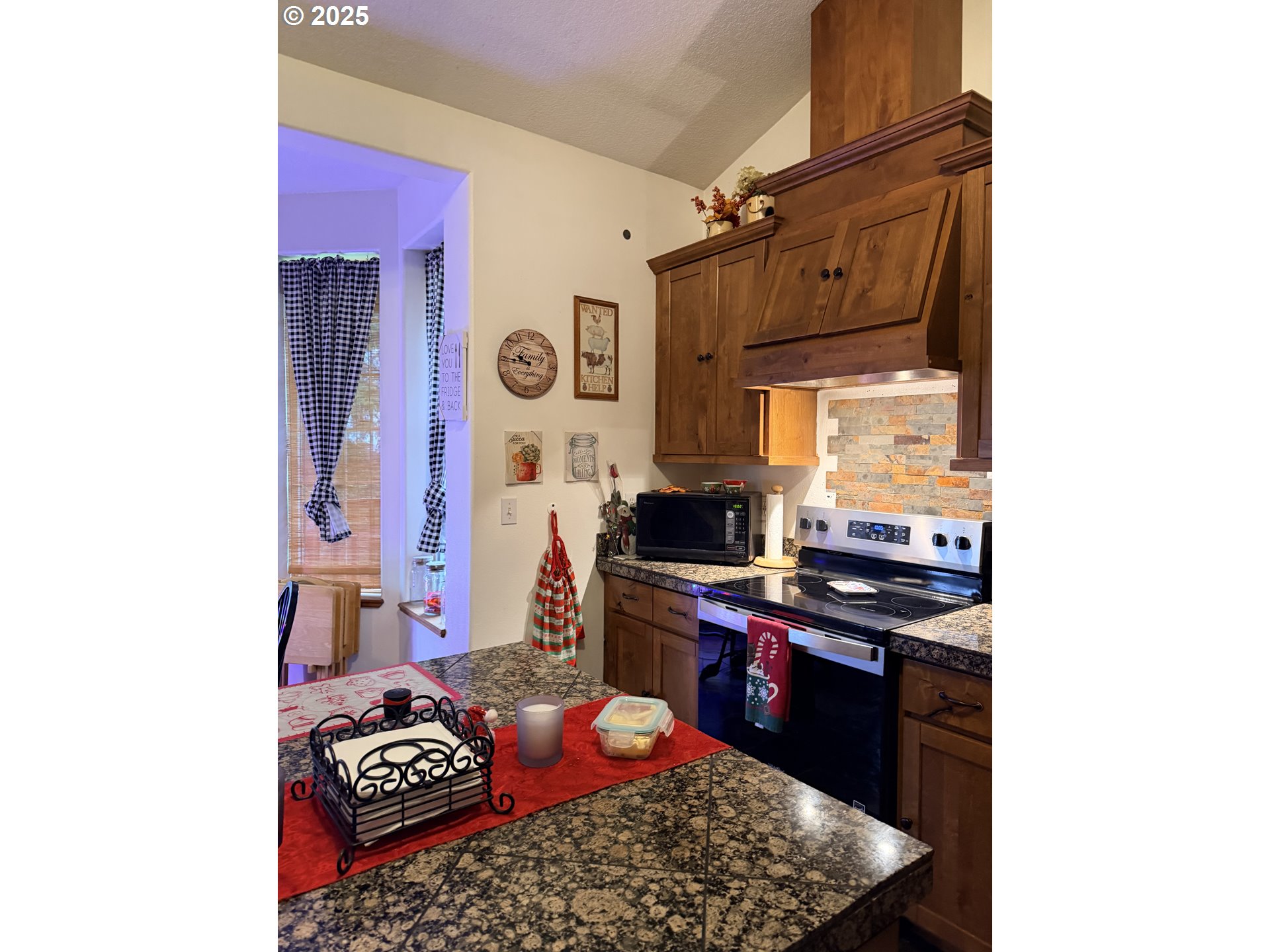 154 Shipview Road Kalama, WA 98625 - Photo 5 of 22 a kitchen with stainless steel appliances granite countertop a stove and a microwave