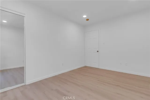 a view of an empty room and cabinets