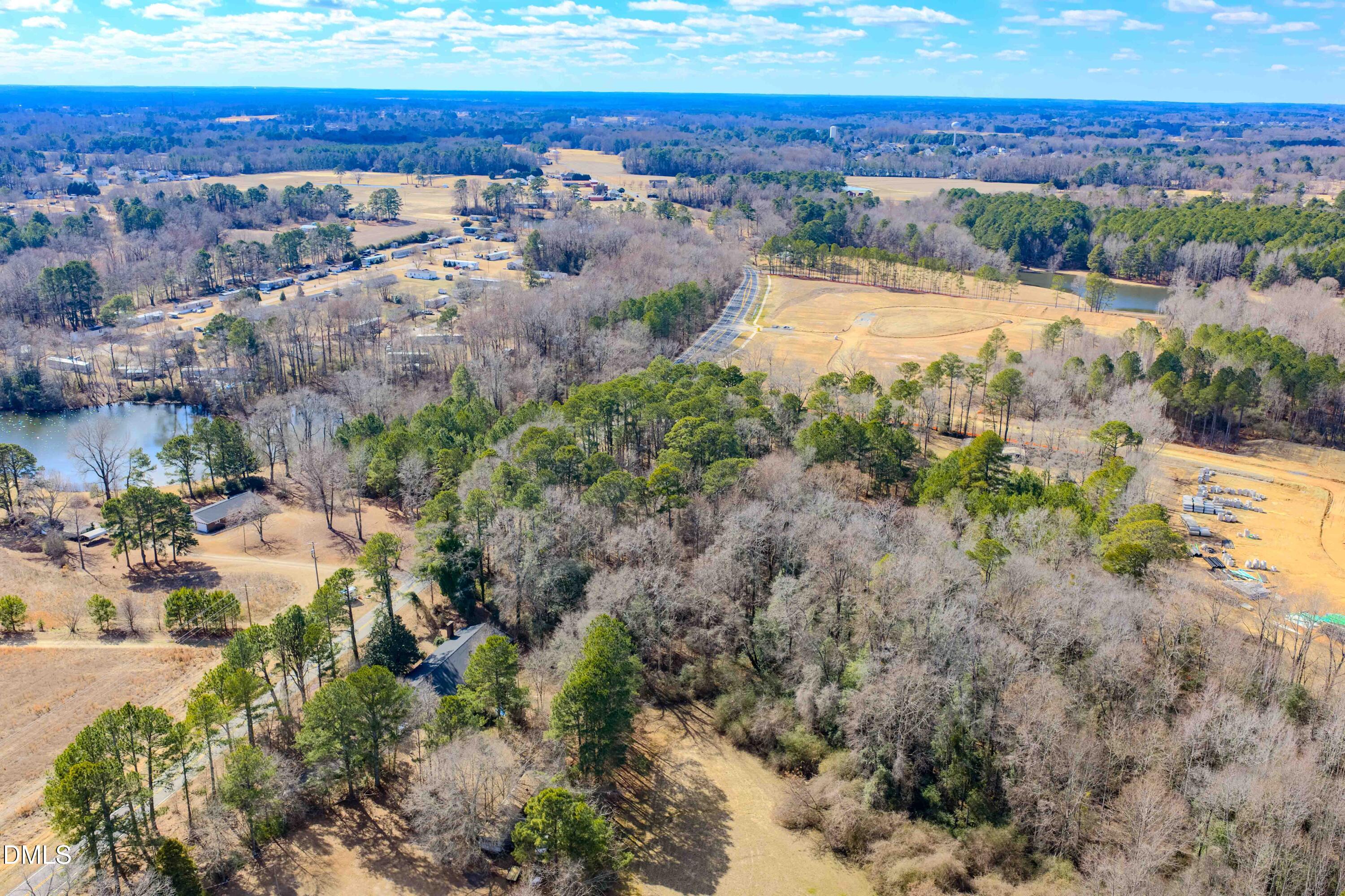 6724 Wimberly Road Willow Spring, NC 27592 - Photo 2 of 36 a view of lake with mountain