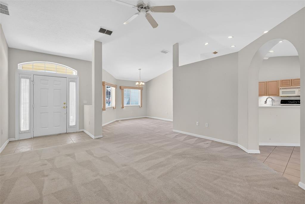 8739 Southeast 140th Place Road Summerfield, FL 34491 - Photo 16 of 45 an empty room with fan and windows