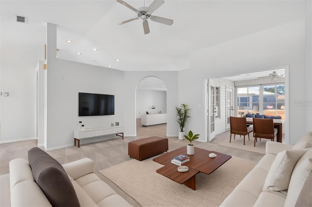8739 Southeast 140th Place Road Summerfield, FL 34491 - Photo 17 of 45 a living room with furniture and a flat screen tv