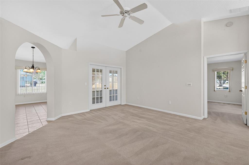 8739 Southeast 140th Place Road Summerfield, FL 34491 - Photo 19 of 45 an empty room with windows and cabinet
