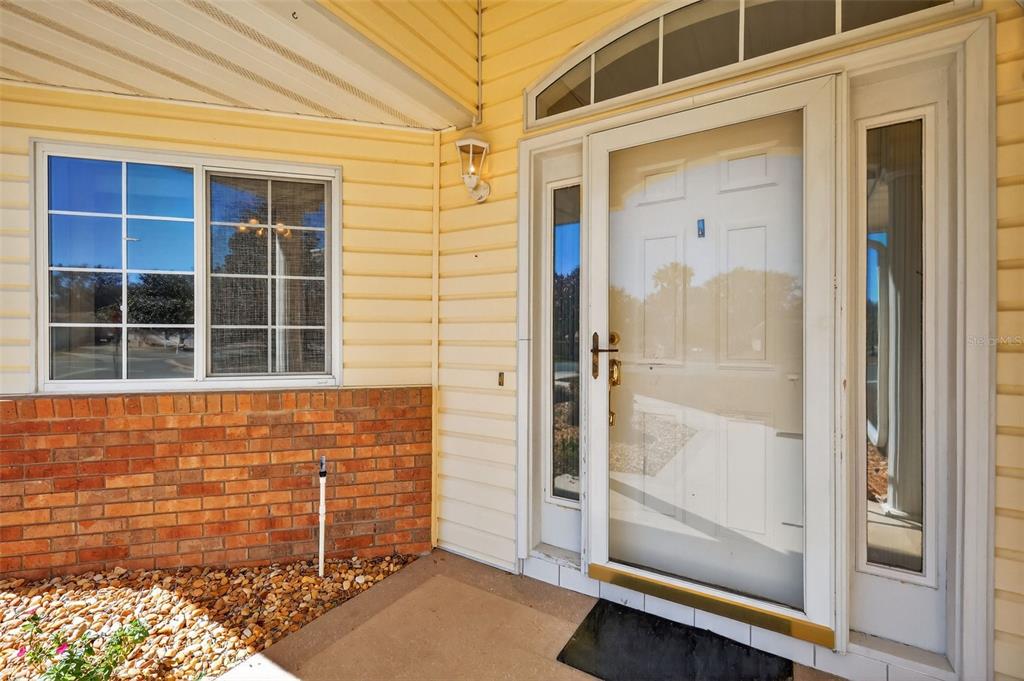8739 Southeast 140th Place Road Summerfield, FL 34491 - Photo 3 of 45 a front view of a house with a window