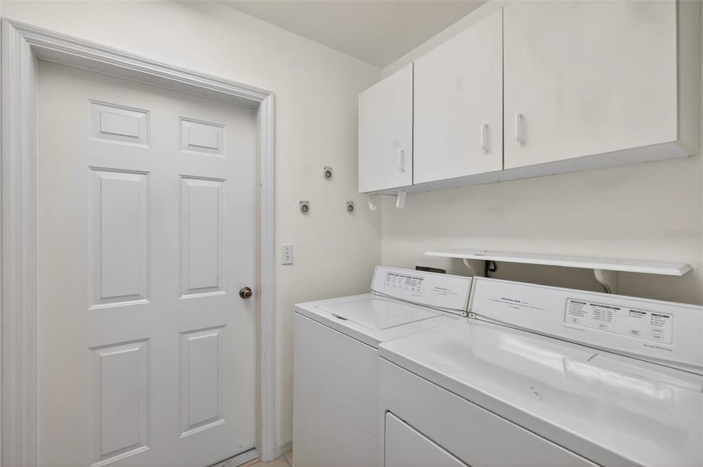8739 Southeast 140th Place Road Summerfield, FL 34491 - Photo 36 of 45 a utility room with dryer and washer